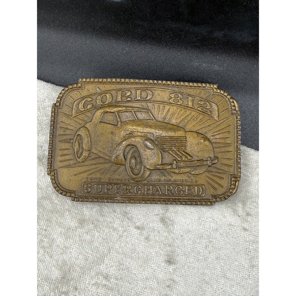 Vintage Indiana Metal Craft Belt Buckle Gold Cord 812 Supercharged Car Brass